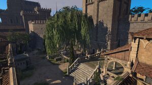 The Graveyard in the lower city. A giant tree casting shade on the gravestones below.