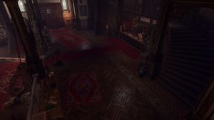 The interior of the Devil's Fee. A red carpet leads up to a counter stationed by Helsik.Devilsh and monstrous trophies and monuments adorn the room.